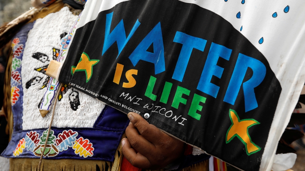 Indigenous activist protests the Dakota Access and Keystone XL pipelines at the White House in Washington