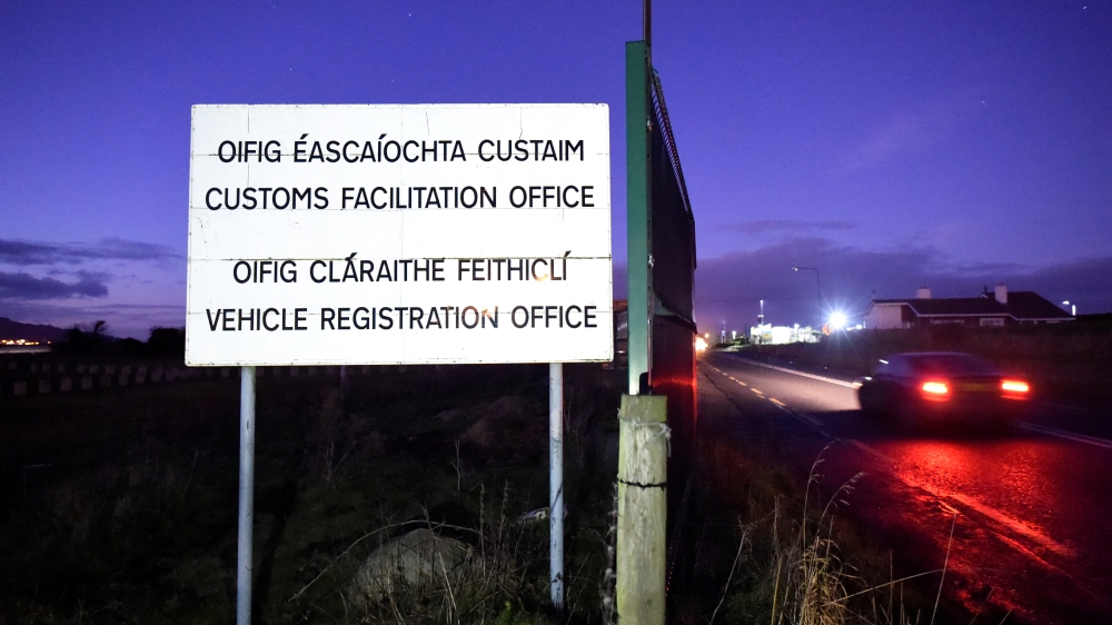 An old sign is seen at a disused customs post for a Customs Facilitation office and Vehicle Registration Office on the border town of Carrickcarnon