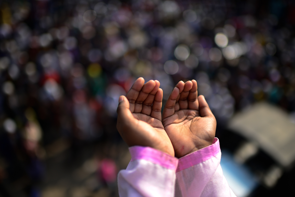 Devotees pray together during "Bishwa Ijtema", the world congregation of Muslims, on the banks of the Turag river. [Mahmud Hossain Opu/Al Jazeera]