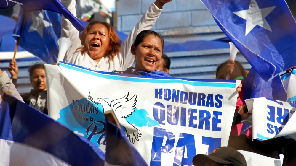 Supporters of President Hernandez carried banners that read