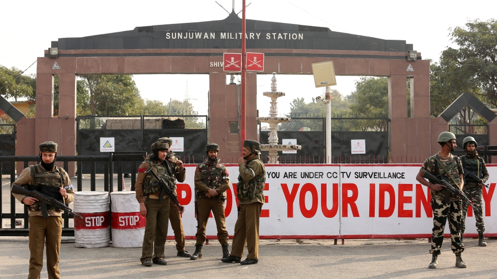 Indian army soldiers stand guard outside an army camp after suspected militants attacked the camp, in Jammu