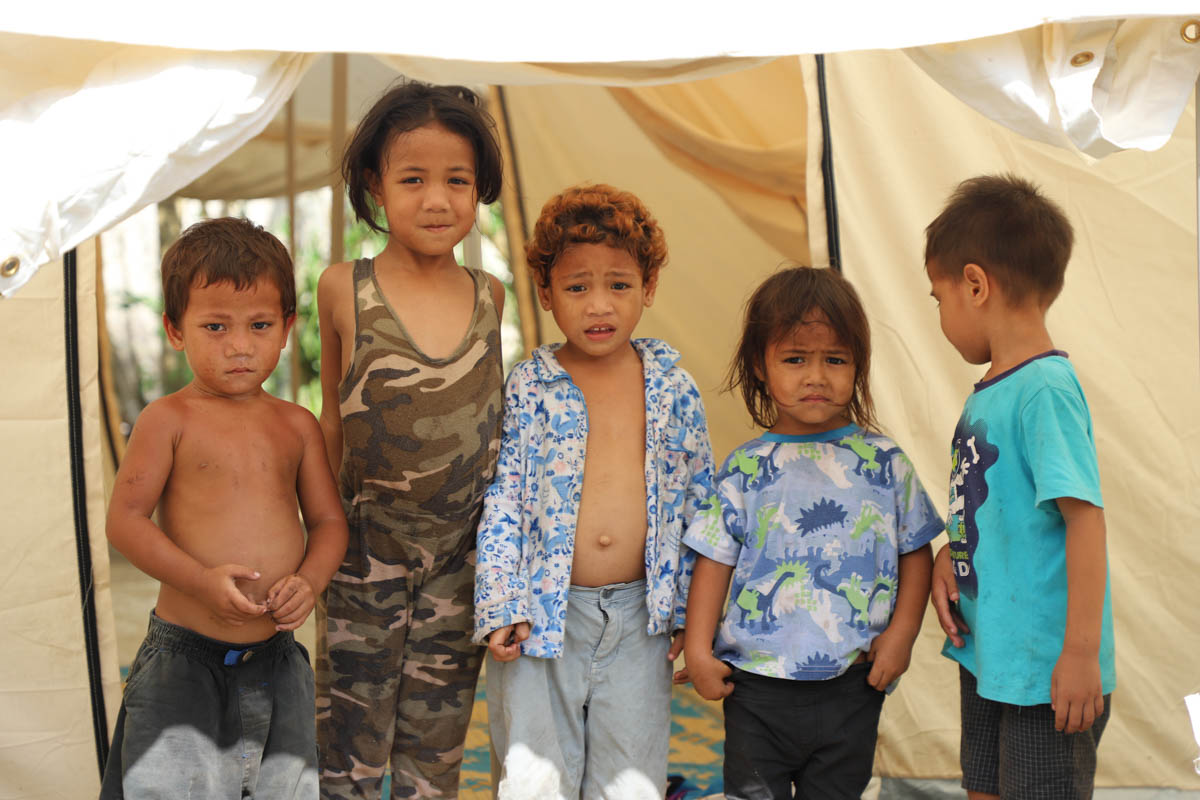 These kids check out their temporary accommodation while their parents work on fixing up their damaged home.