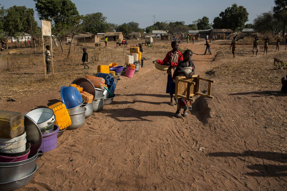 Containers for water are lined up outside a well near the Avenue Church in Paoua, Central African Republic, January 27, 2018. With the influx of some 65,000 IDPs, the population of Paoua has more than