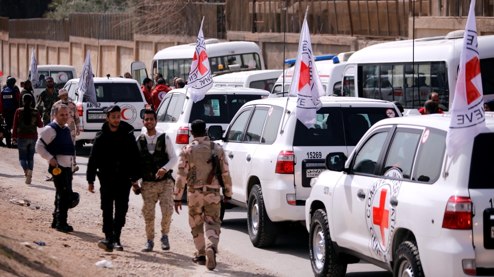 International Committee of the Red Cross convoy seen crossing into eastern Ghouta near Wafideen camp in Damascus