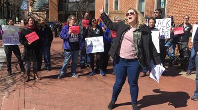 Demonstrators outside the court on Thursday afternoon [Al Jazeera]