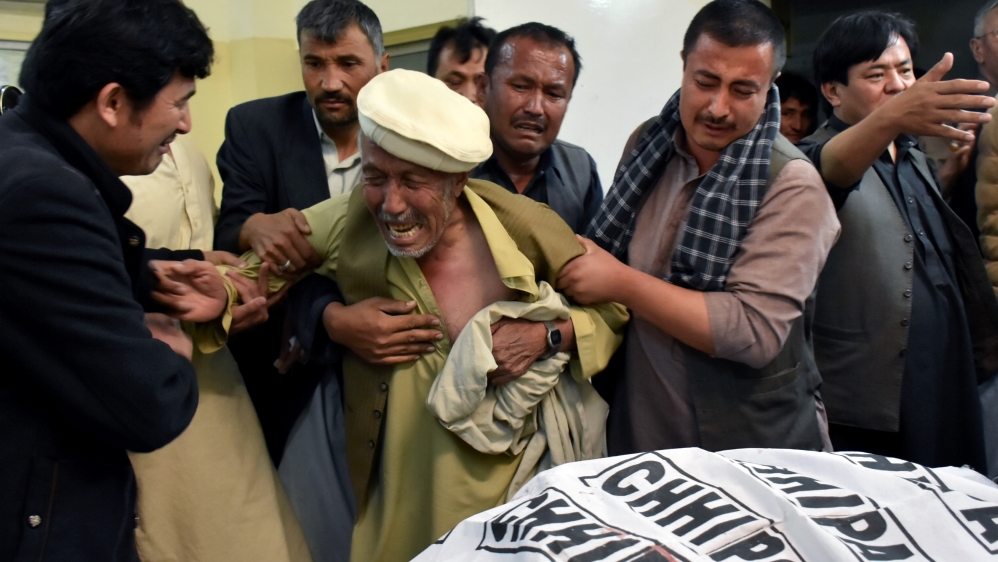 A father of a member of Hazara community, who was killed along with others sone by unidentified gunmen, mourns the death of his son at hospital in Quetta