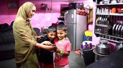 Sajida and her two sons [Puja Changoiwala/Al Jazeera]