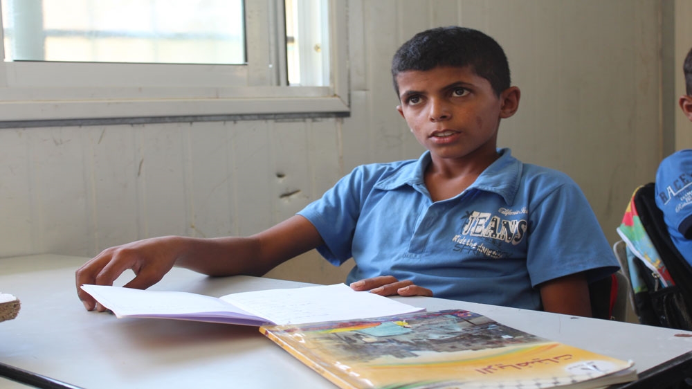 Mohammad Dahouk wants to be an Arabic teacher at the Itarat School, but his education could come at an abrupt stop if his school is destroyed by Israeli forces [Shatha Hammad/Al Jazeera]