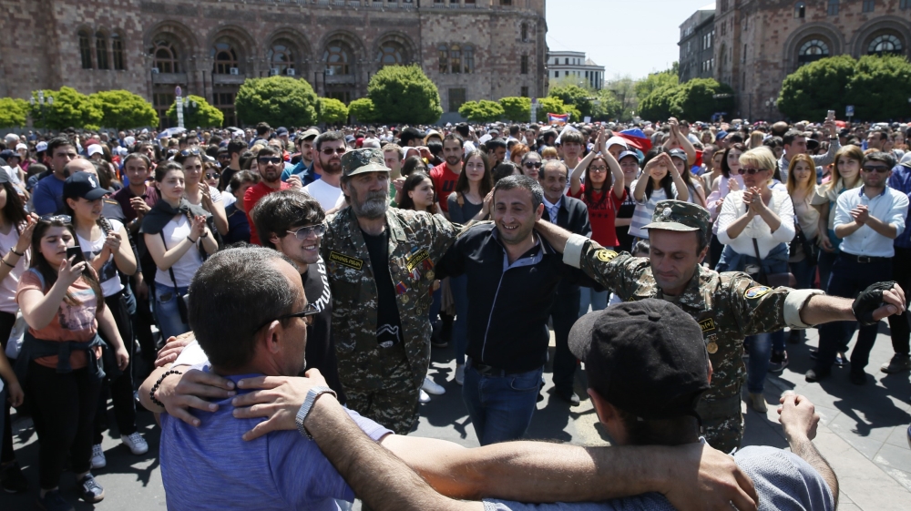 Armenian opposition supporters dance on the street after protest movement leader Nikol Pashinyan announced a nationwide campaign of civil disobedience in Yerevan