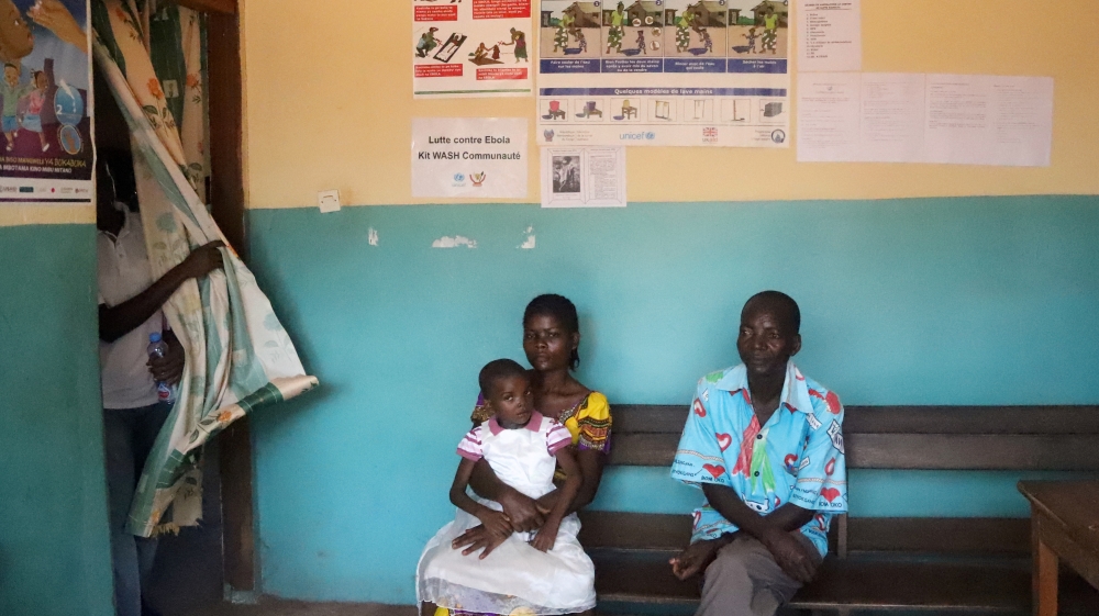 Patients seeking medical attention sit at the health centre in the commune of Wangata, during a vaccination campaign against the outbreak of Ebola, in Mbandaka