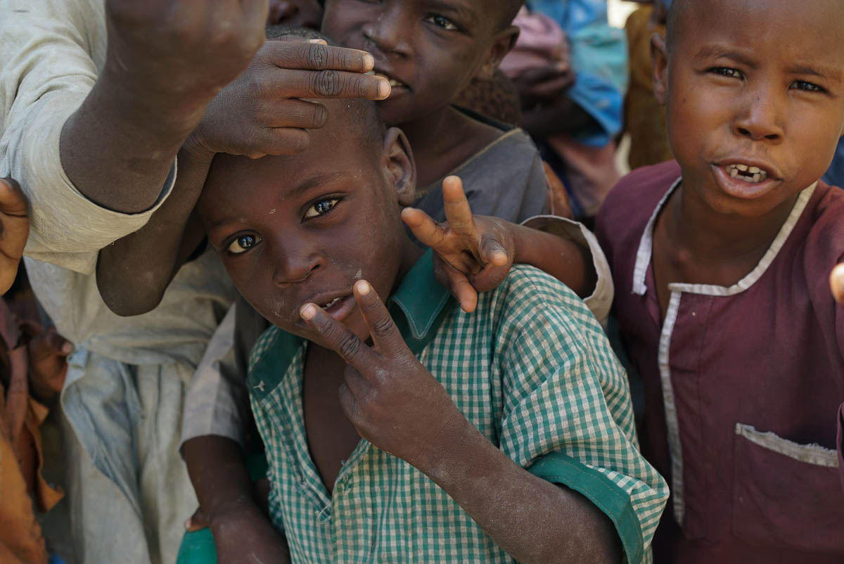 A group of young Nigerian boys living in  NYSC IDP camp, named for its previous function as an orientation camp for Nigeria’s Youth Service Corps (NYSC), in Maiduguri, Nigeria.  More than half of IDPs