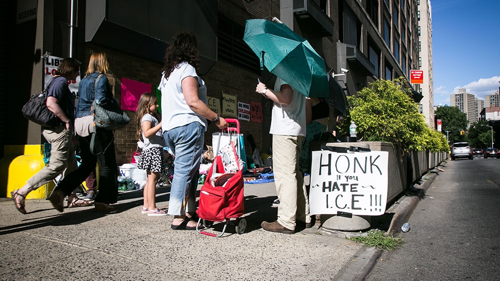 Demonstrators standing with Occupy ICE NYC protest the detainment and deportation of immigrants [Karla Ann Cote/NurPhoto via Getty Images] 