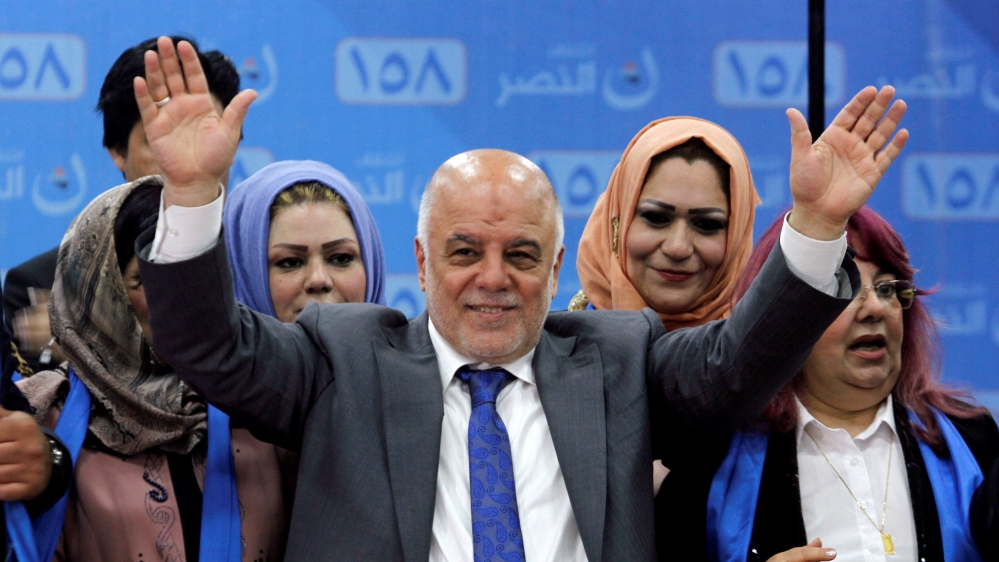 FILE PHOTO: Iraqi Prime Minister Haidar al-Abadi attends the election campaign, along with his supporters in Kirkuk