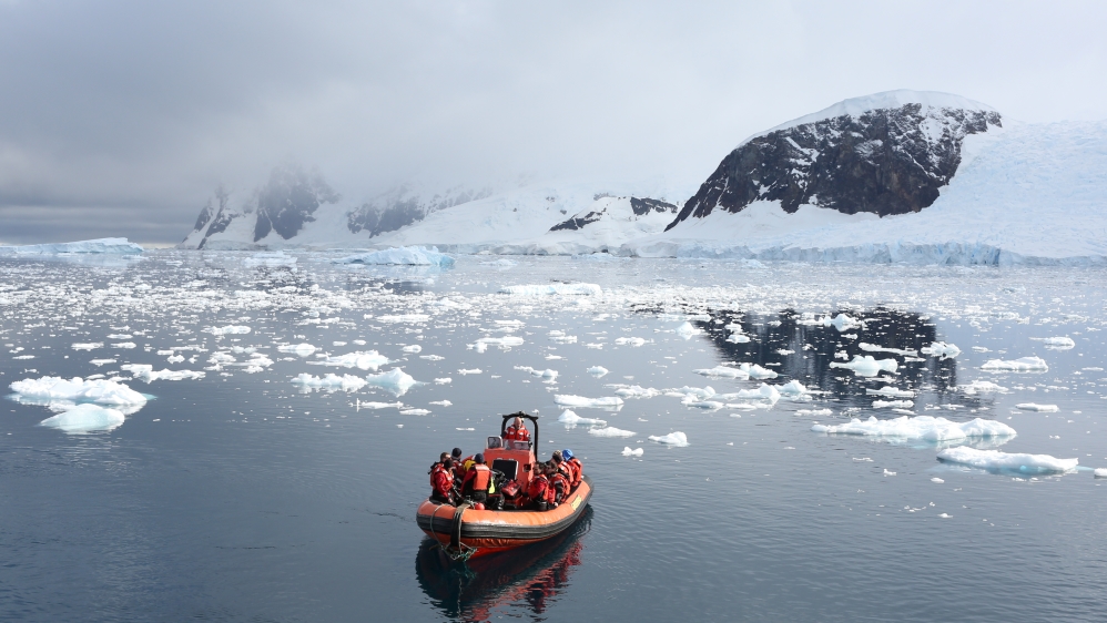 A Greenpeace boat floats in Neko Harbour, Antarctica