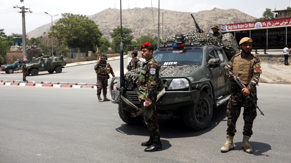 Afghan security forces keep watch at the site of a suicide attack in Kabul, Afghanistan [Omar Sobhani/Reuters]