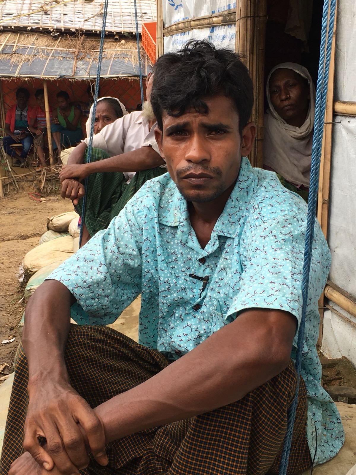 Gul's son, Ollie, says: 'They set the village ablaze ... they slaughtered people ... and we escaped out of fear' [Mohammed Jamjoom/Al Jazeera]