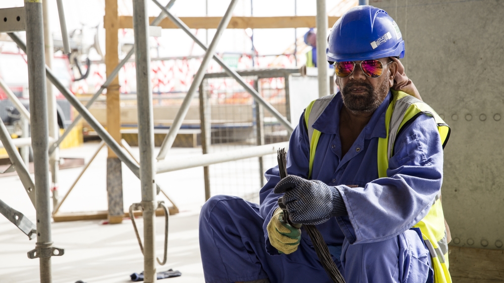 Mewa Singh arrived in Qatar 14 years ago after paying almost $1,400 to an agent. He earns around $330 a month [Faras Ghani/Al Jazeera]