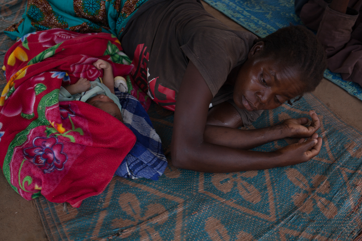 On the 13th of June 2018, a woman and her child nap in Bombe Bakari, Cameroon. The day before, from 6 PM to midnight, their village, Issi, has been taken over by the armed group “Siriri”. The newly ar