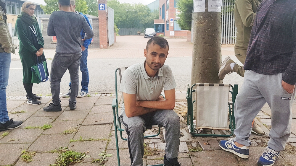 Hundreds of people have come out in support of 23-year-old Afghan Mirwais Ahmadzai, pictured, and Rahman Shah [Simon Jones/Al Jazeera]