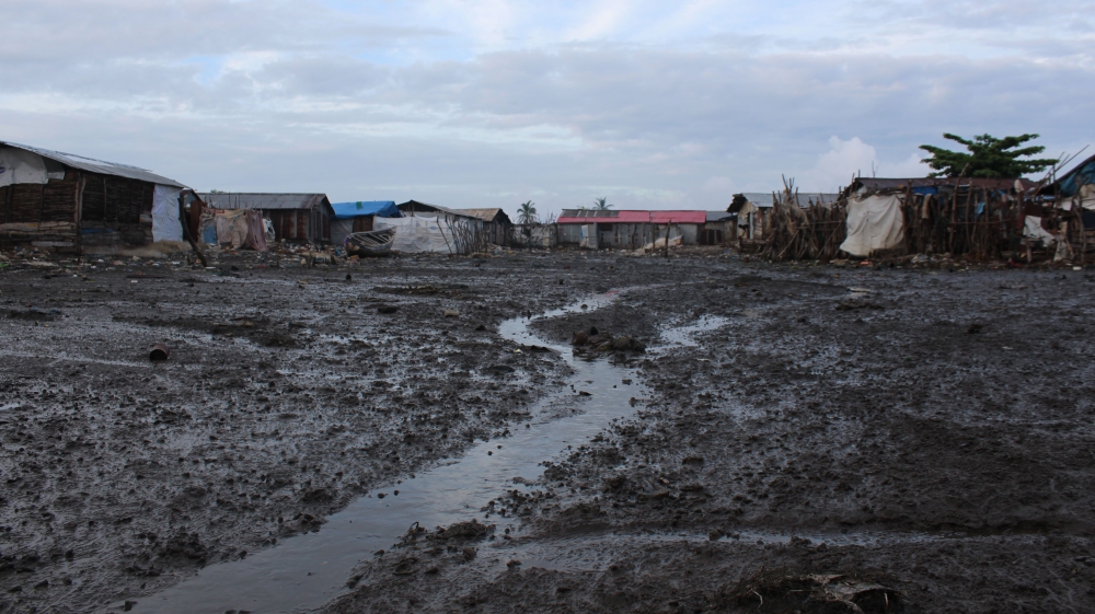A soggy main street in Yelibuya [Mara Kardas-Nelson/Al Jazeera]