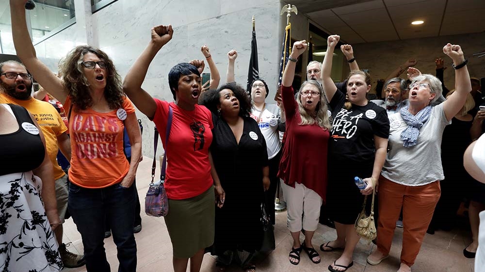 At least 56 people, protesting Kavanaugh's nomination, were arrested in Senate office buildings on Thursday [Yuri Gripas/Reuters] 
