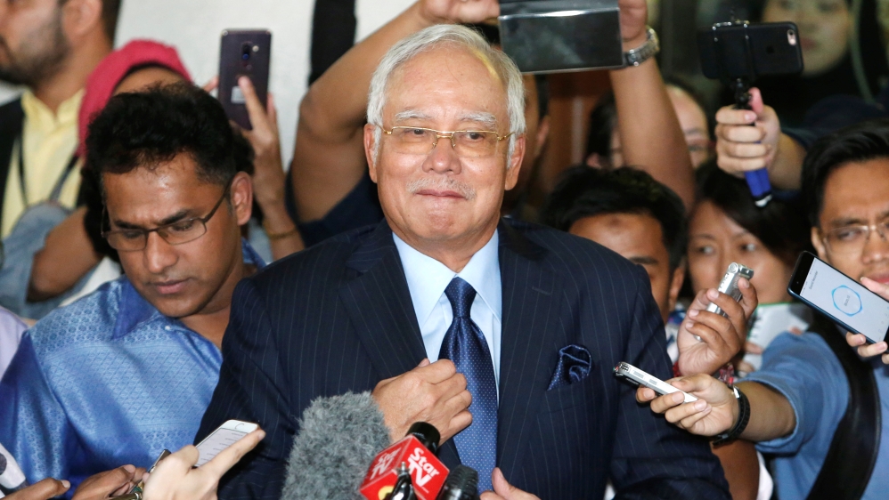 Malaysia''s former Prime Minister Najib Razak prepares to speak to journalists as he leaves a court in Kuala Lumpur