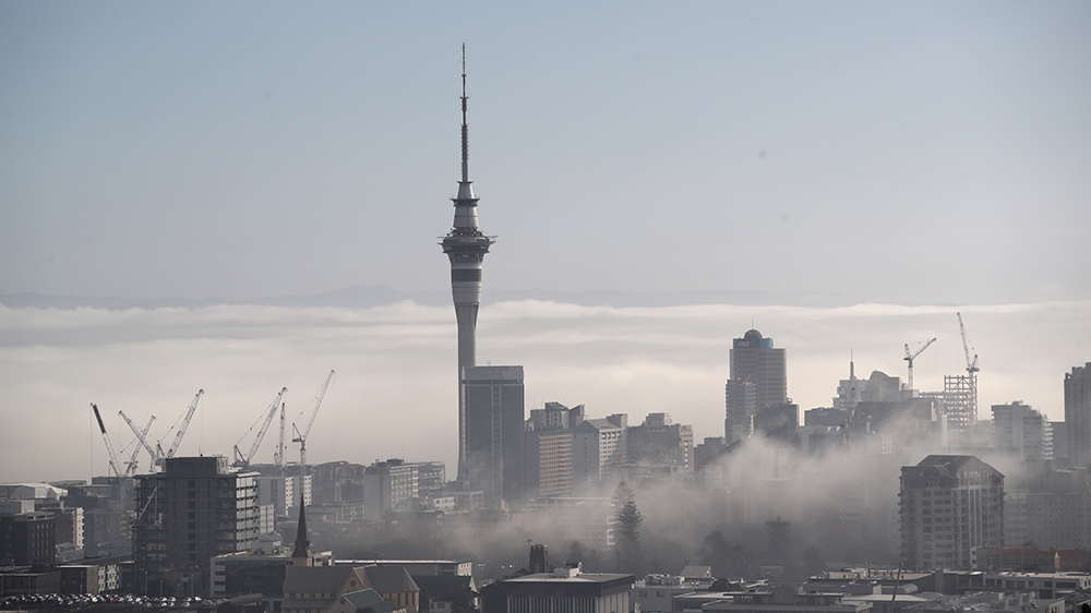 AUCKLAND, NEW ZEALAND - AUGUST 02: The Auckland Sky Tower is pictured as fog blankets the city on August 2, 2018 in Auckland, New Zealand. Fog restrictions at Auckland Airport were lifted at 8:20am bu