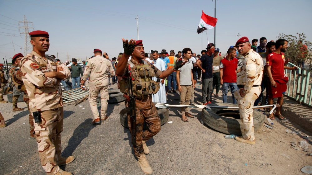 Iraqi soldiers are seen at Umm Qasr Port after it was closed by protesters in south of Basra