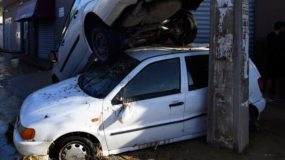 Tunisian coastal governante of Nabeul shows cars piled upon each other after being swept away following deadly flash flooding in the town of Dar Chaabane.