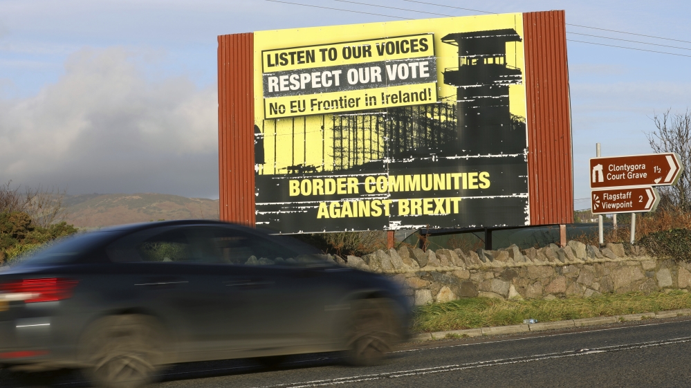 A motorist makes his way north along the old Belfast to Dublin road on the Irish border between Northern Ireland and the Irish Republic close to the town of Newry, Northern Ireland [File: Peter Morrison/AP]