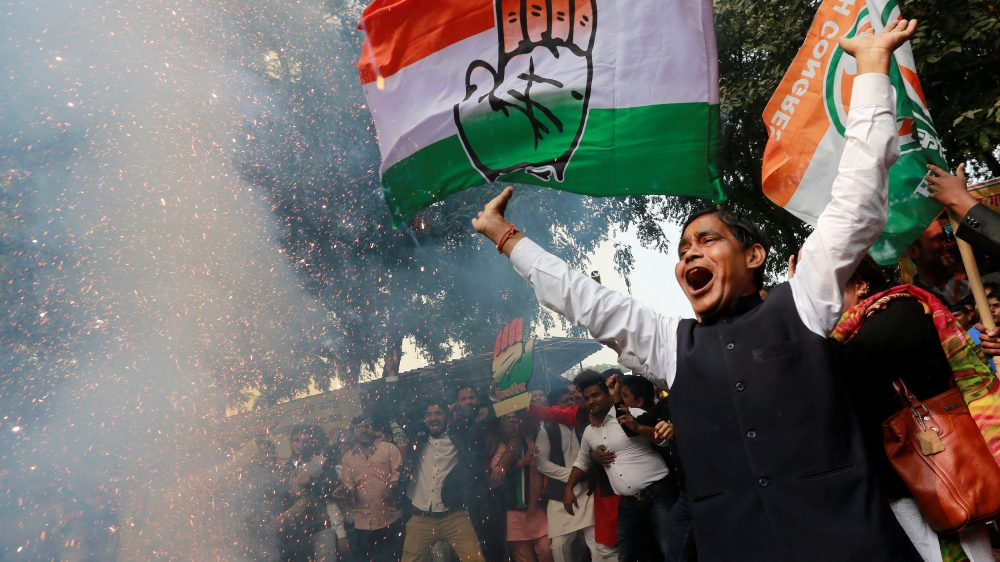 Supporters of India''s main opposition Congress party celebrate after initial poll results at the party headquarters in New Delhi