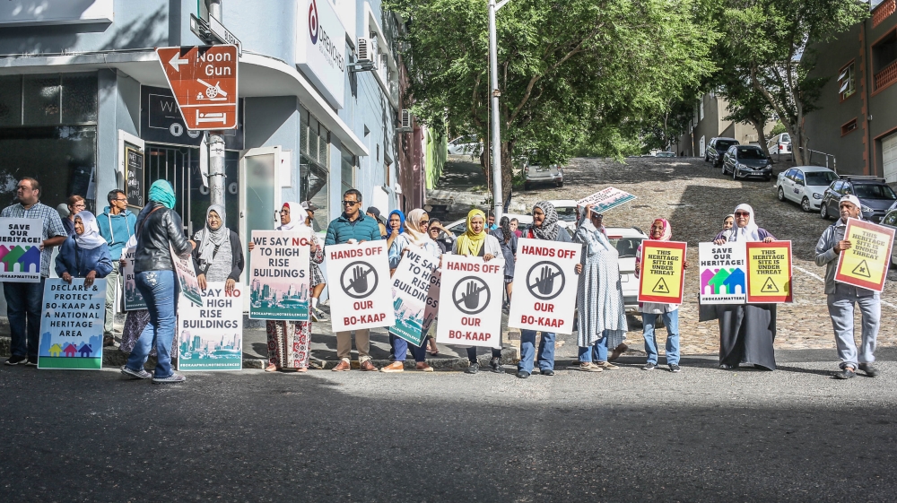 Residents protest in Bo Kaap, where house prices are rising [Erica Jenkin/Al Jazeera]