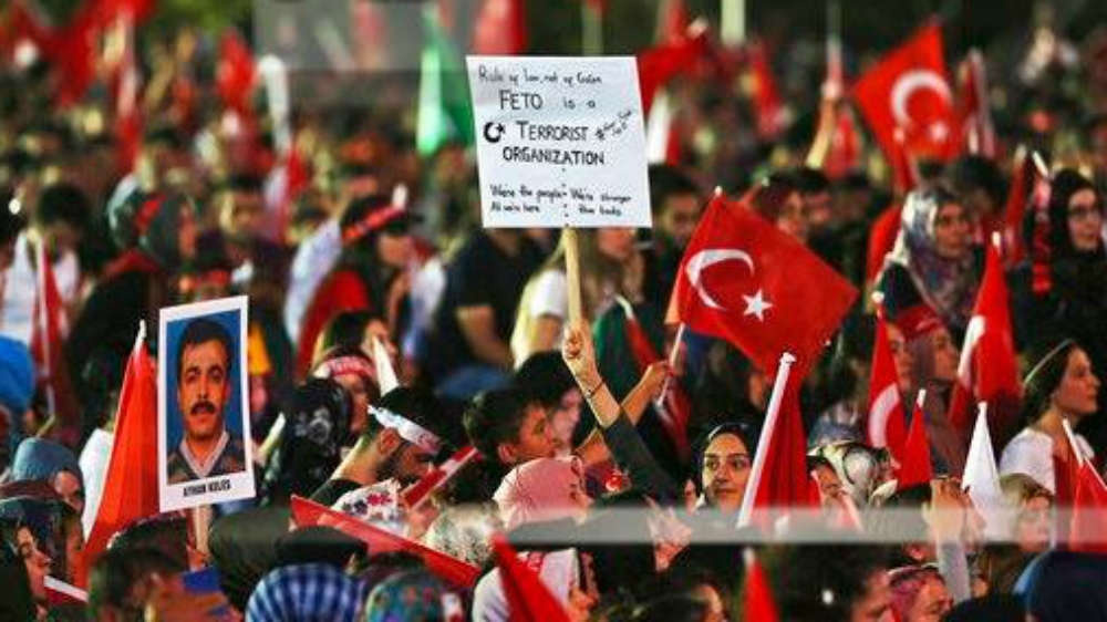 People participate in a ceremony to commemorate the one year anniversary of the July 15, 2016 failed coup attempt, at Turkey''s Parliament in Ankara,