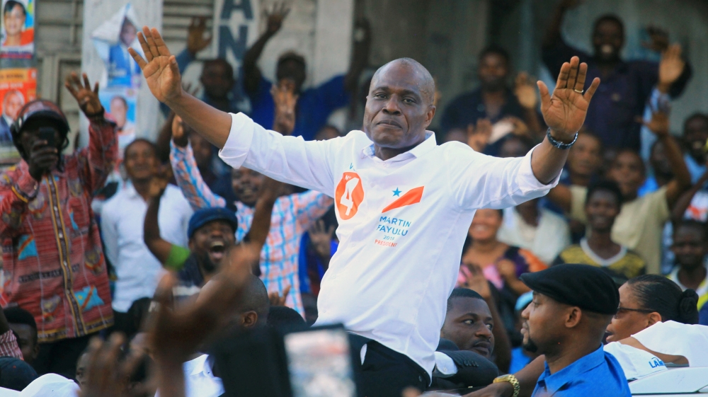 Congolese joint opposition Presidential candidate Martin Fayulu waves to supporters as he campaigns in Goma