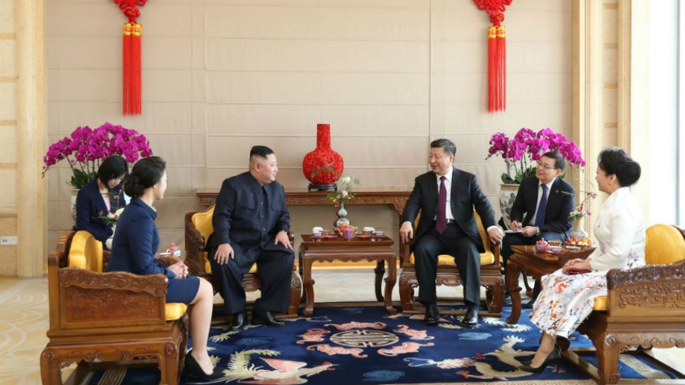 The two leaders, joined by their wives, attend a meeting in Beijing [Huang Jingwen/Xinhua via AP]