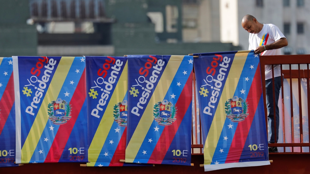 The capital, Caracas, was lined with posters declaring 'I Am President' [Manaure Quintero/Reuters]