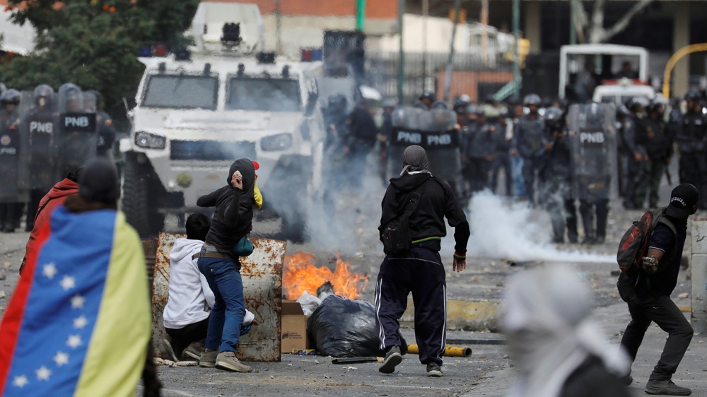 Demonstrators clash with police during a protest [File: Manaure Quintero/Reuters] 