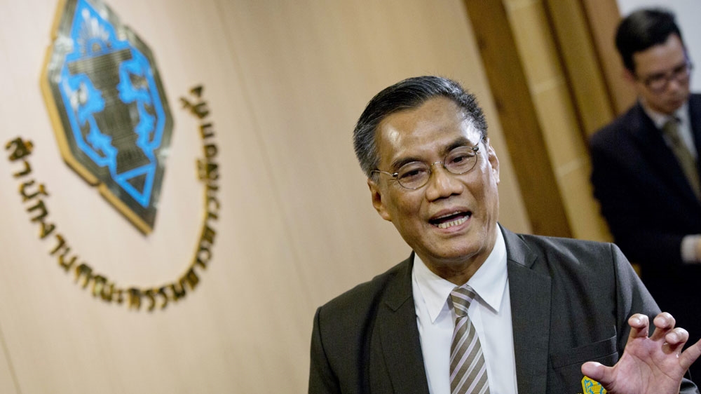 Chairman of the Election Commission Ithiporn Boonpakong talks to media following a press conference in Bangkok, Thailand, Wednesday, Jan. 23, 2019.