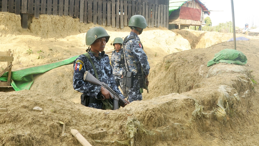 Myanmar border guard police stand guard at Goke Pi outpost in Buthidaung during a government organized media tour in Rakhine