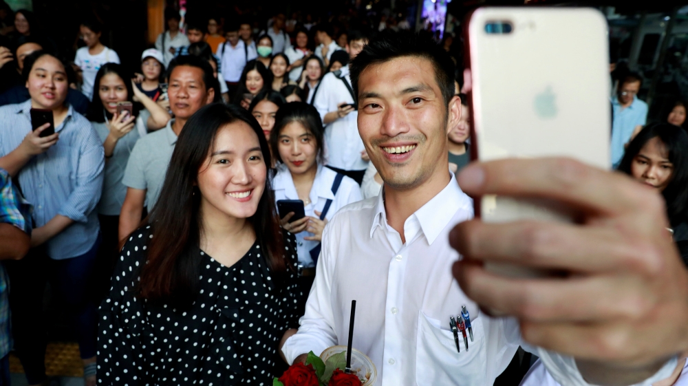 Thanathorn takes a selfie with his supporters during a rally in Bangkok [Soe Zeya Tun/Reuters]