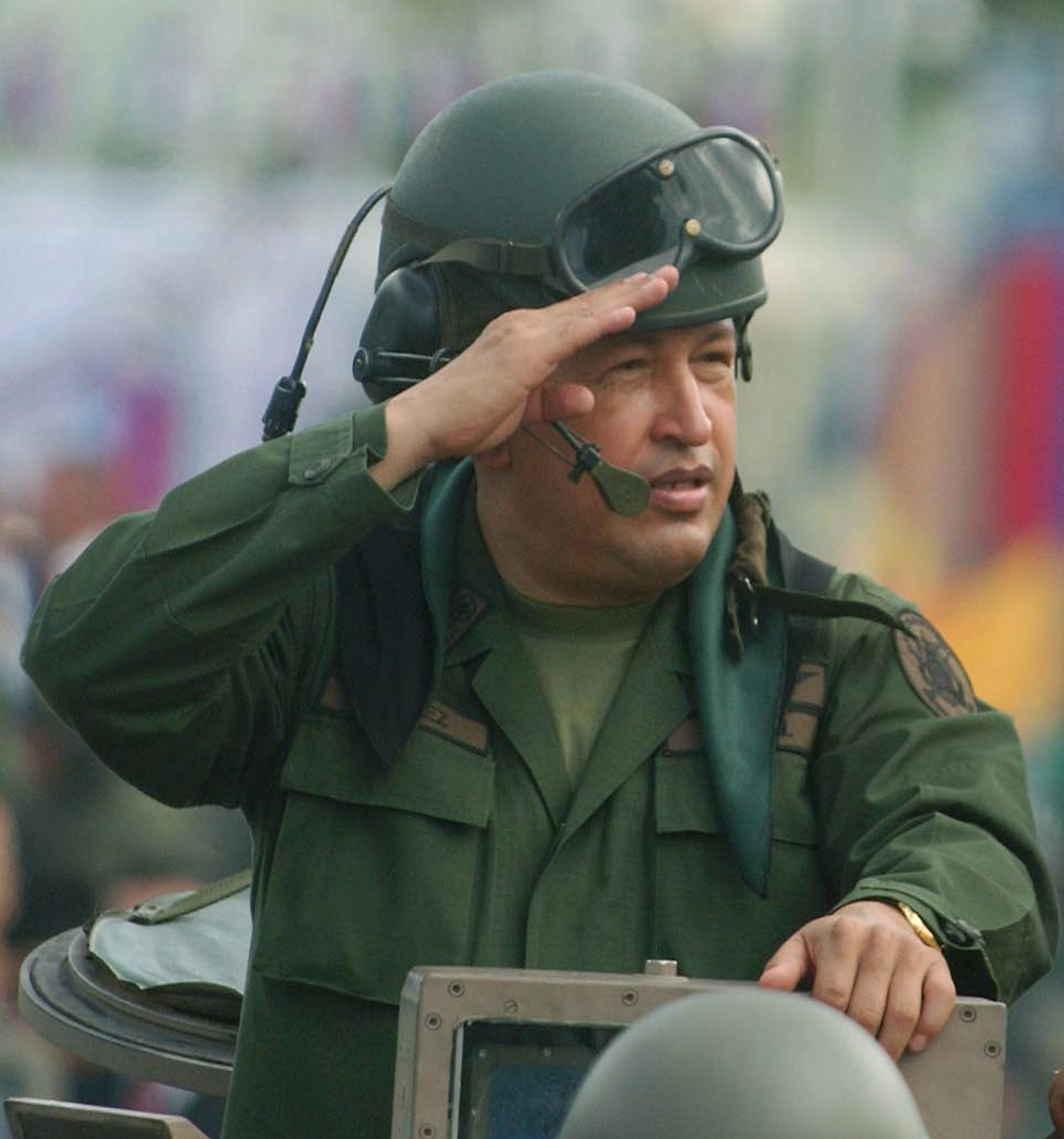 Venezuelan President Hugo Chavez salutes the troops during a military parade in Caracas [File: Miraflores/AP]