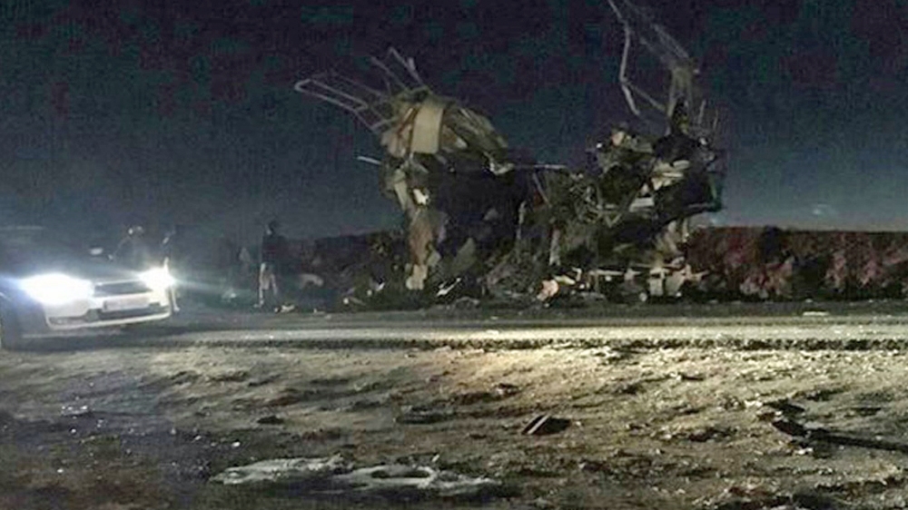 The wreckage of the bus that was targeted by a suicide bomber on Wednesday [FARS NEWS/EPA]