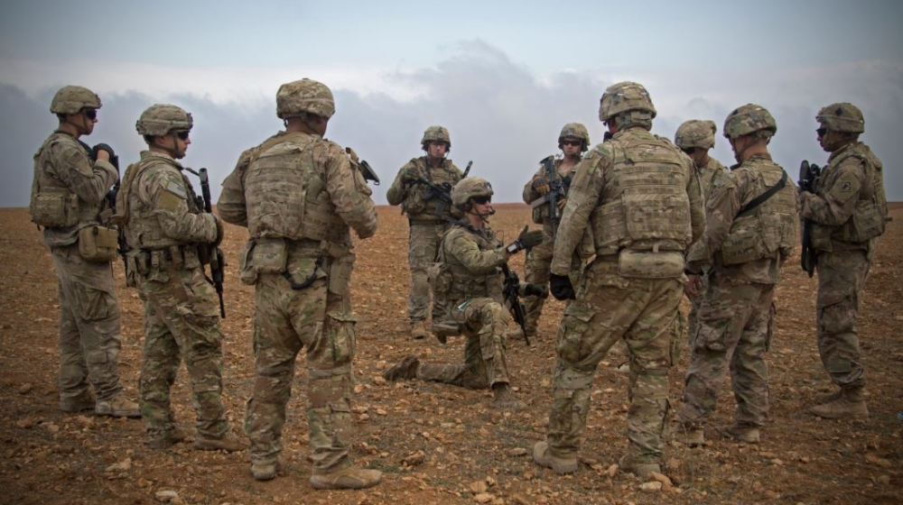 U.S. soldiers gather for a brief during a combined joint patrol rehearsal in Manbij, Syria.