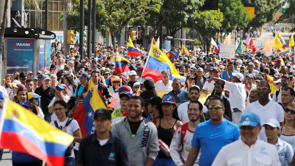 Opposition supporters take part in a rally to commemorate the Day of the Youth and to protest against President Maduro's government [Manaure Quintero/Reuters]
