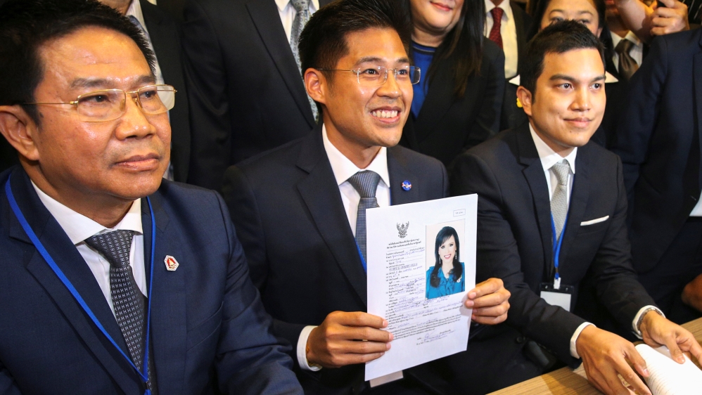Thai Raksa Chart party leader Preechapol Pongpanich, holds up application of candidate for Prime Minister, Thailand''s Princess Ubolratana Rajakanya Sirivadhana Varnavadi, at the election commission of