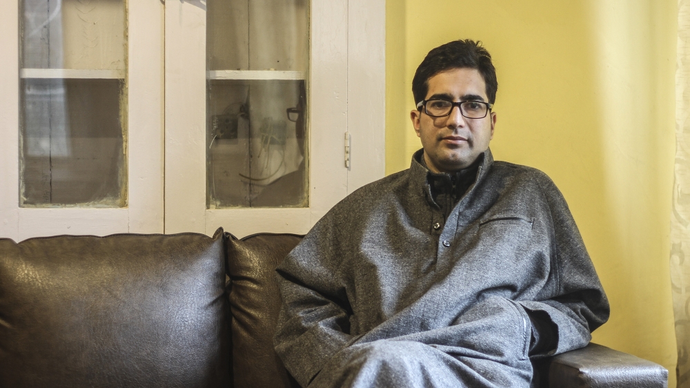 Shah Faesal in his office in Rajbagh, Srinagar, while talking to Al Jazeera [Sameer Mushtaq/Al Jazeera]