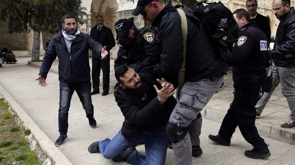 Israeli police arrests aPalestinian at al Aqsa mosque compound in Jerusalem, Monday, Feb. 18, 2019. Israeli police officers have arrested several Palestinians for "causing a disturbance"