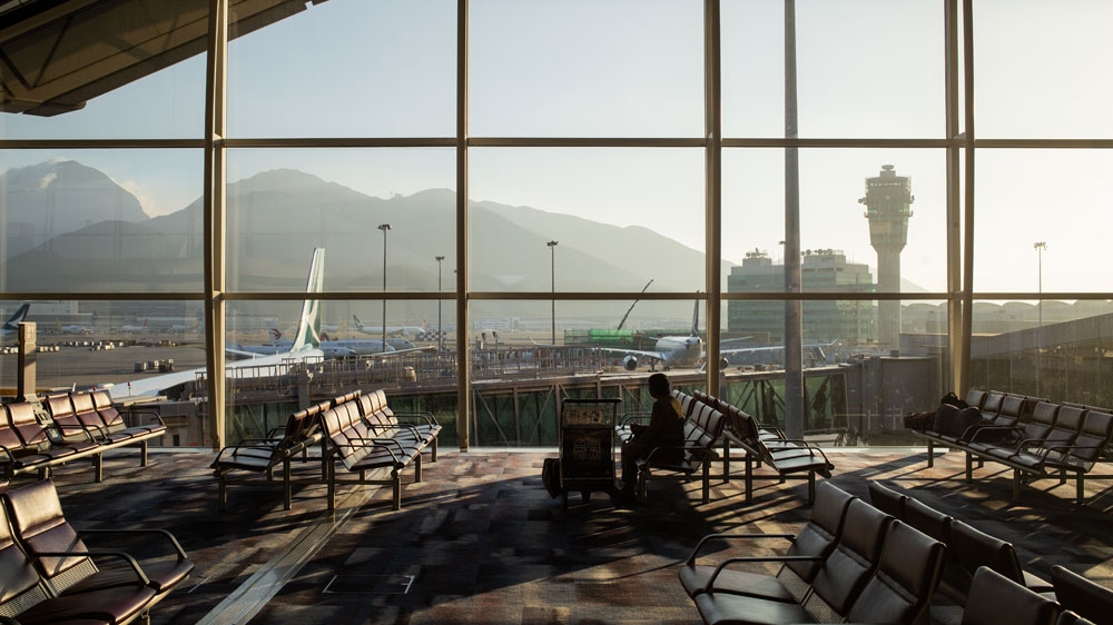 A passenger waits to board a plane at Hong Kong International Airport in Hong Kong, China, 02 December 2018 (issued 03 December 2018). EPA-EFE/ROMAN PILIPEY