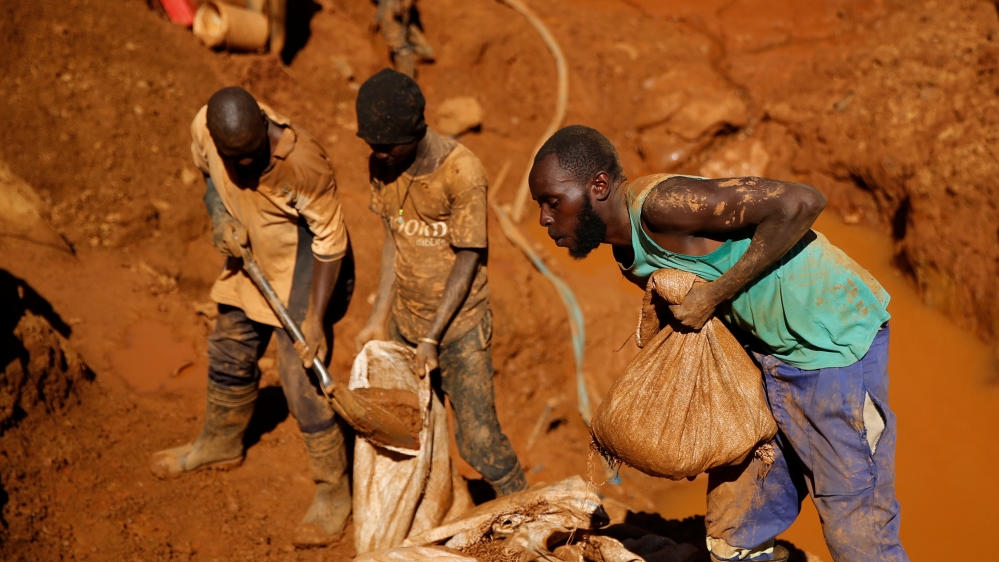 Illegal artisanal gold miners work at an open mine after occupying parts of Smithfield farm, owned by the former President Robert Mugabe''s wife Grace Mugabe, in Mazowe