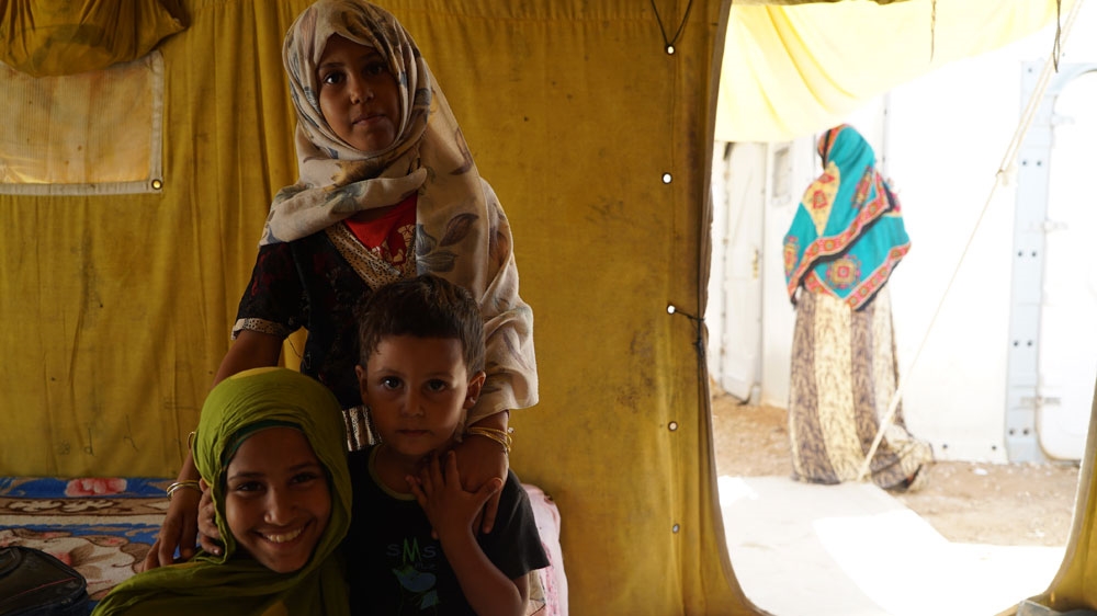 
Khalid Muhammad hopes to gain asylum in Europe for the betterment of his wife and three children [Faisal Edroos/Al Jazeera]
